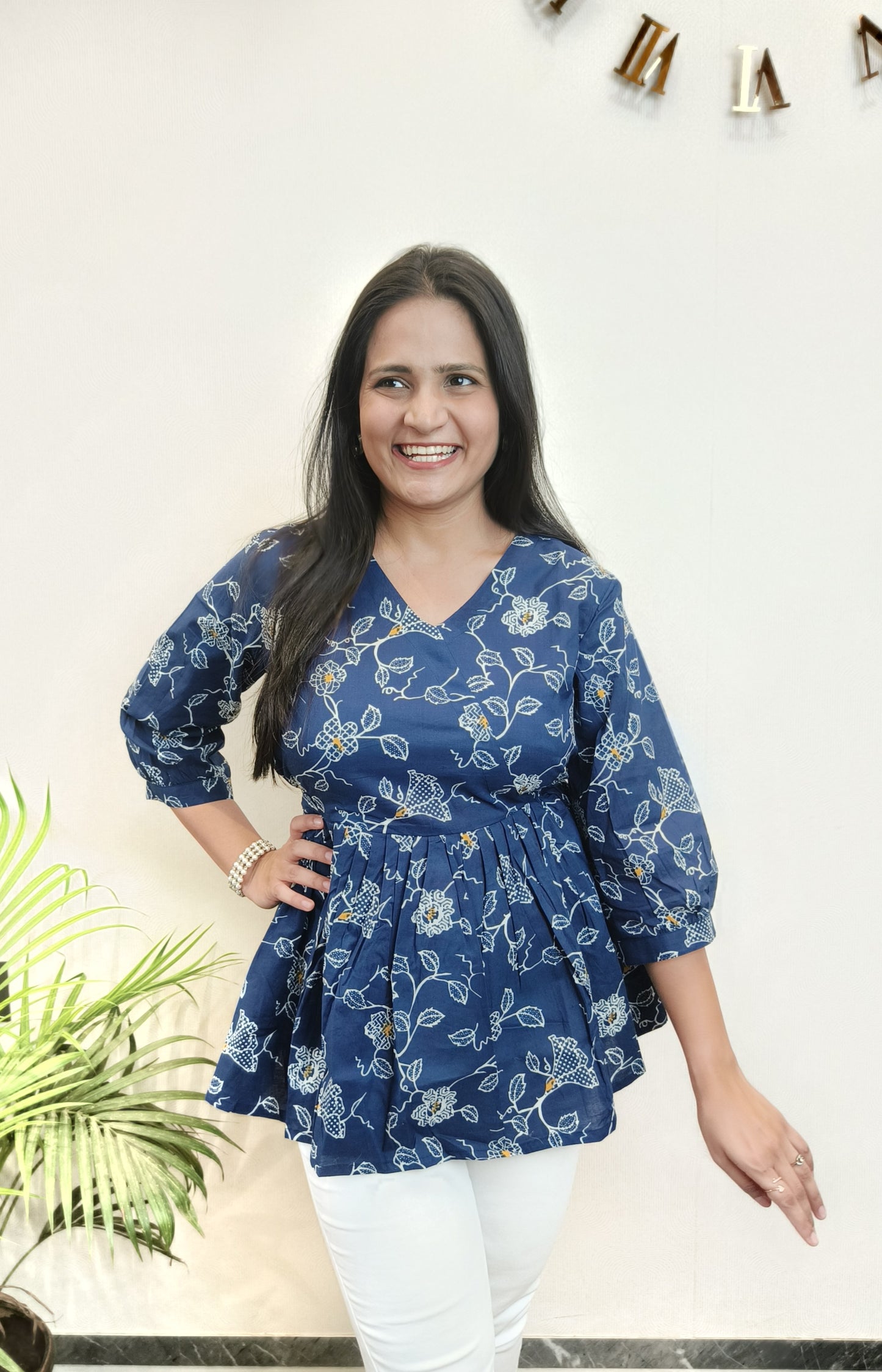 Dark blue with white floral peplum top