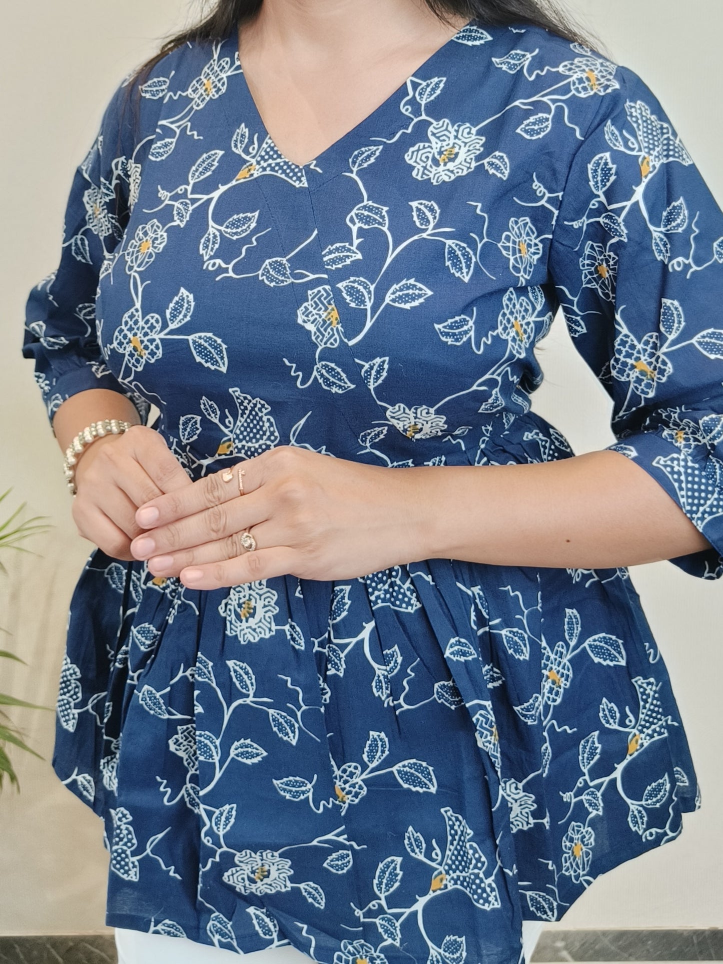 Dark blue with white floral peplum top