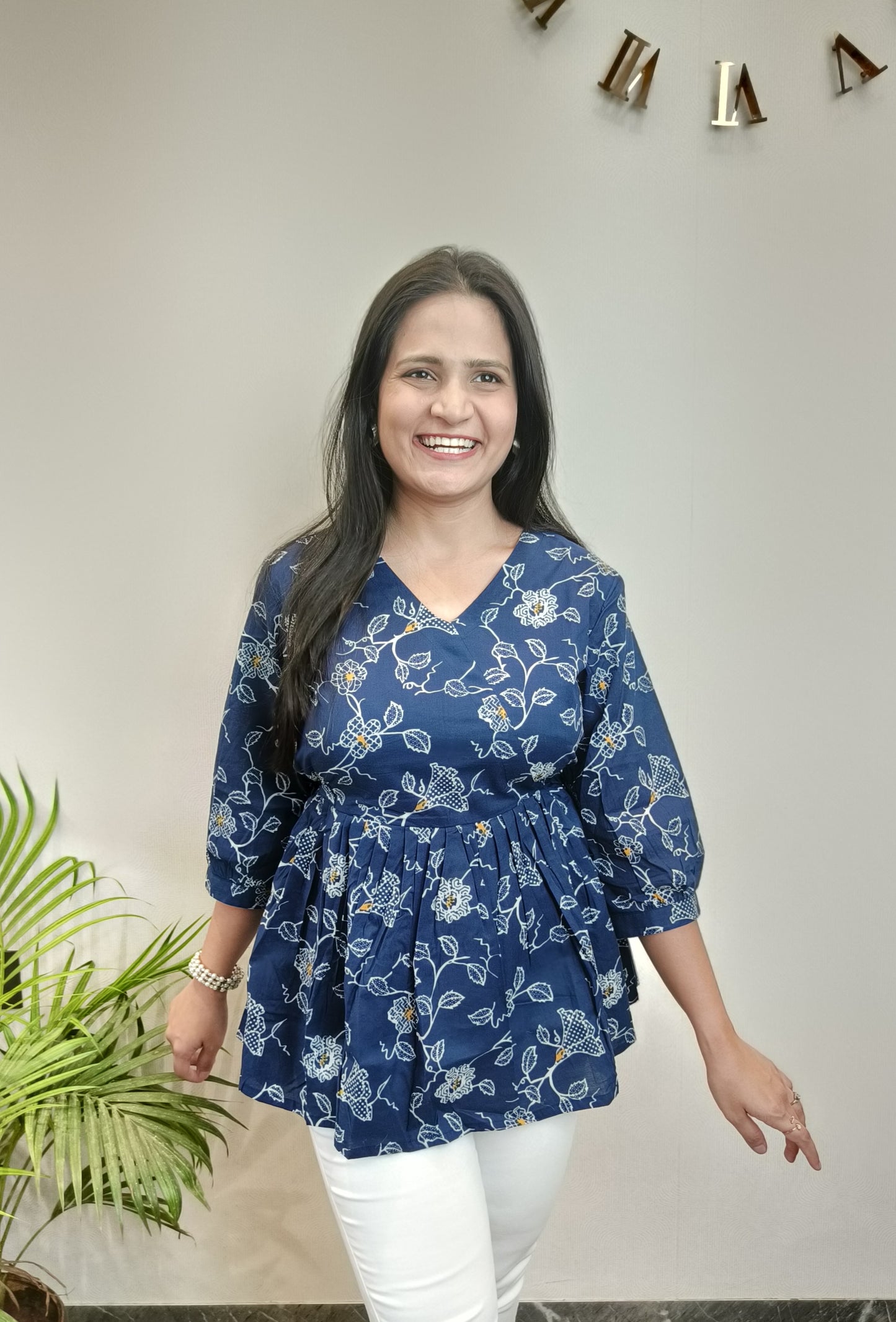 Dark blue with white floral peplum top