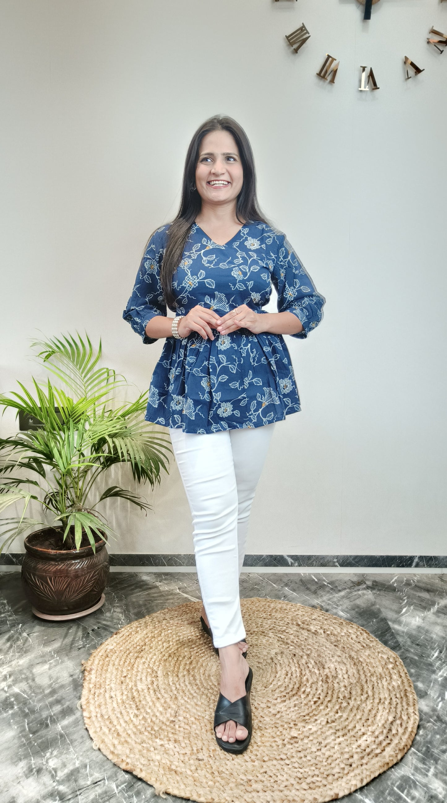 Dark blue with white floral peplum top