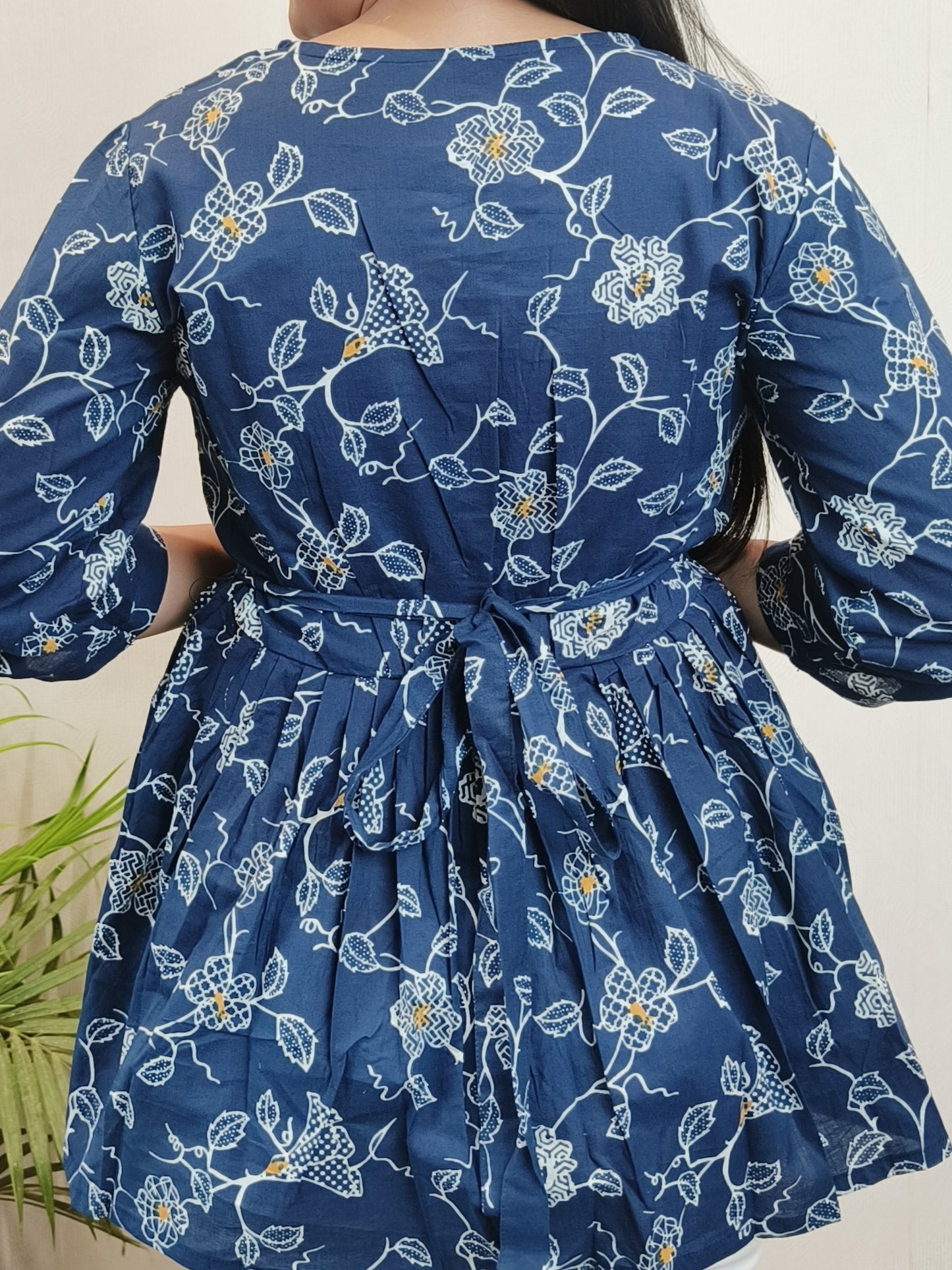 Dark blue with white floral peplum top