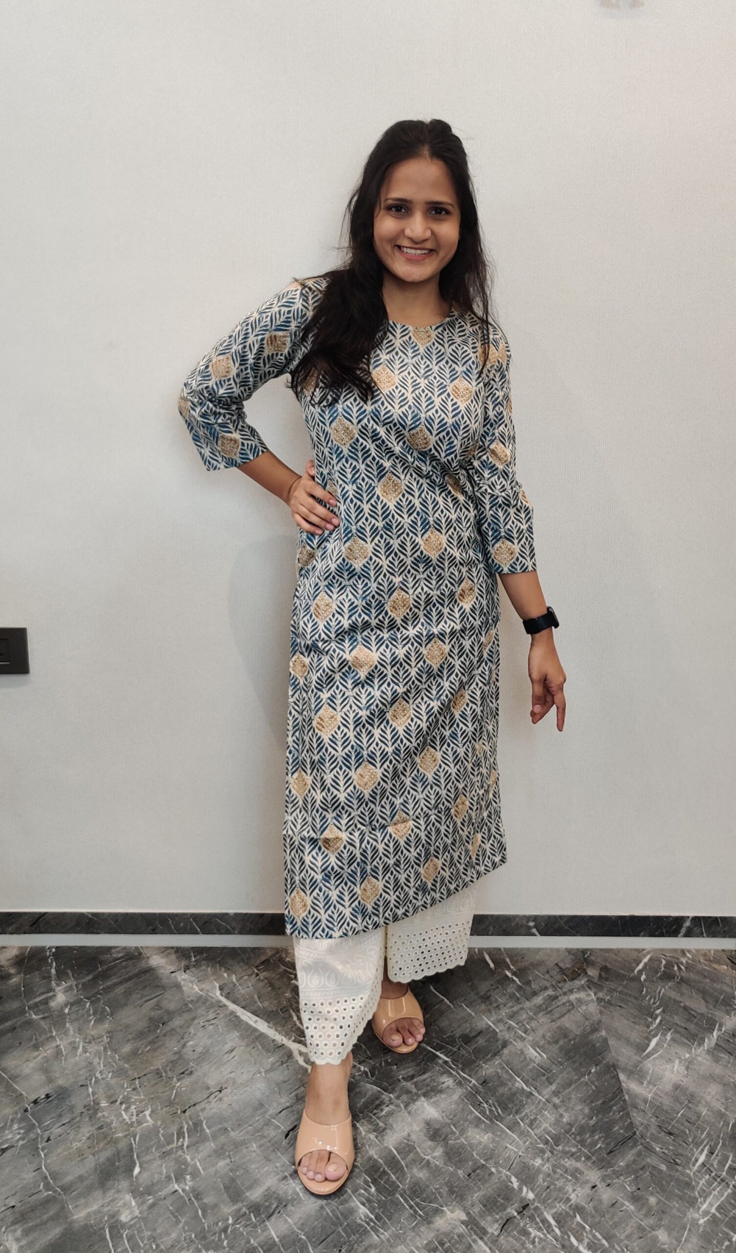 Cream long kurta with blue and golden leaf print