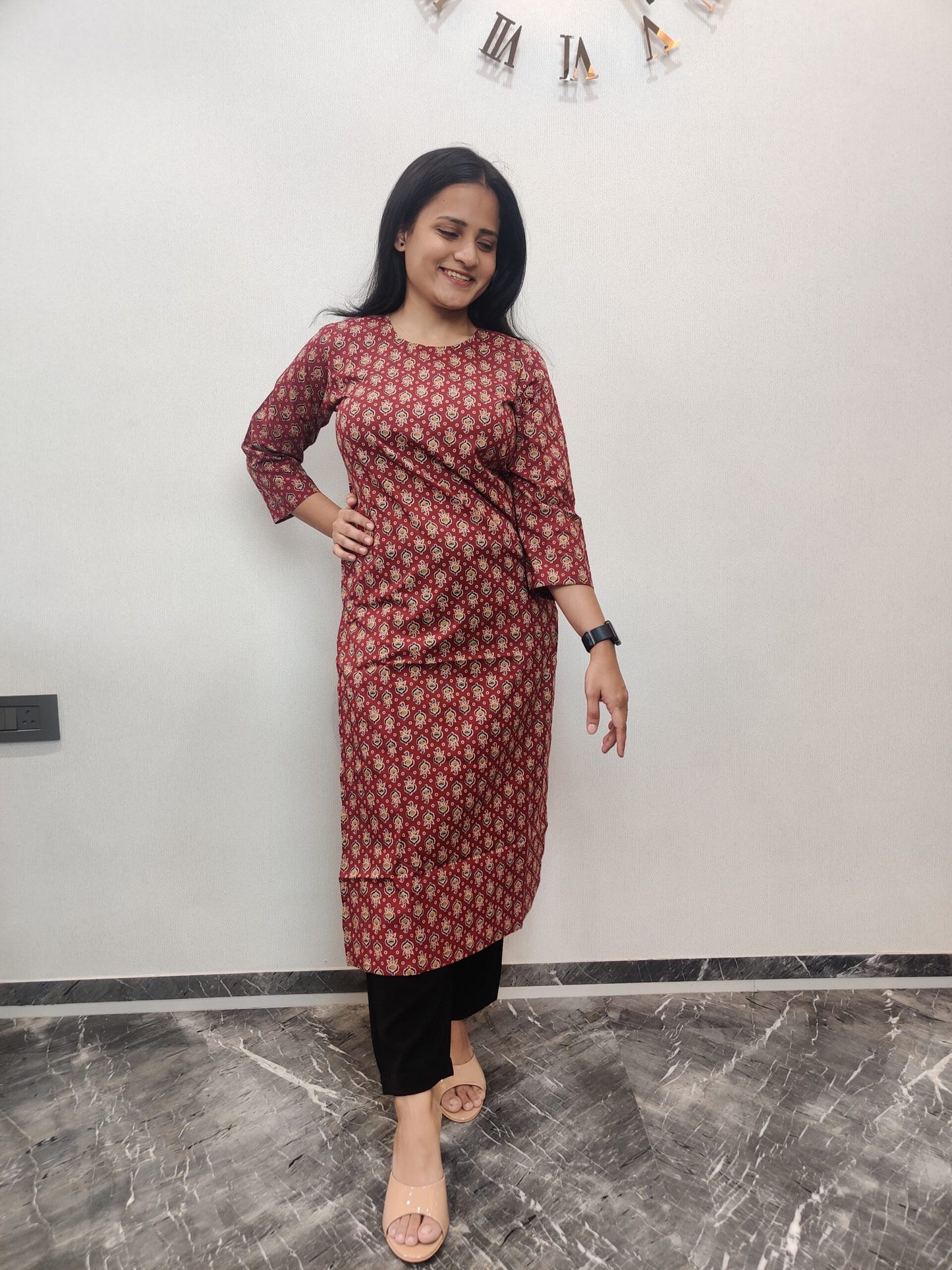 Red long kurta with black and yellow motifs