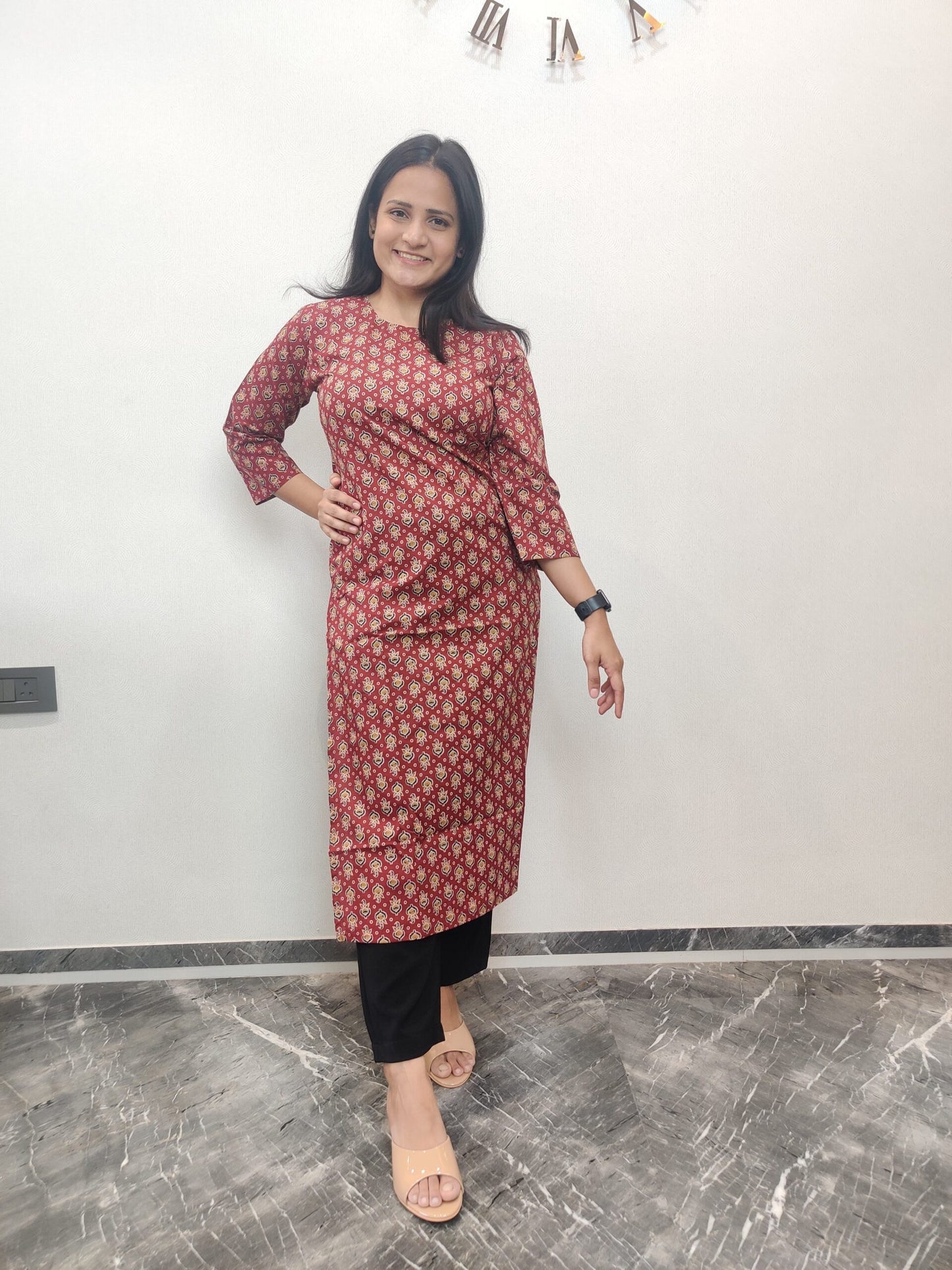 Red long kurta with black and yellow motifs